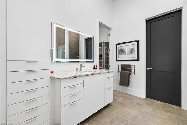 a bathroom with a double vanity sink mirror and double