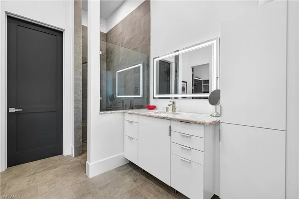 a bathroom with a sink and a mirror