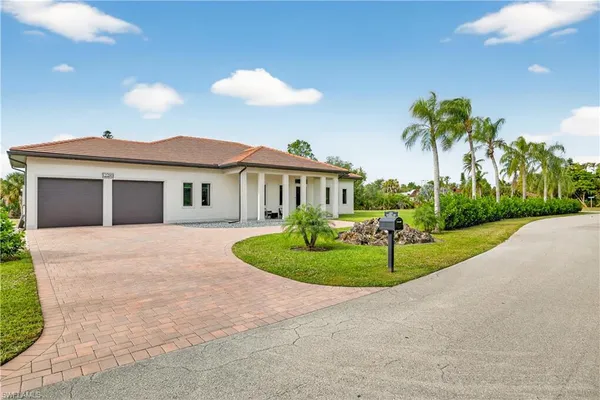 a house with a garden and a swimming pool