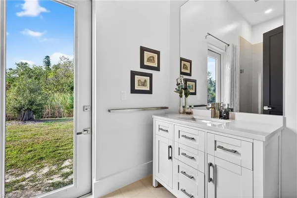 a bedroom with a bed and a shower