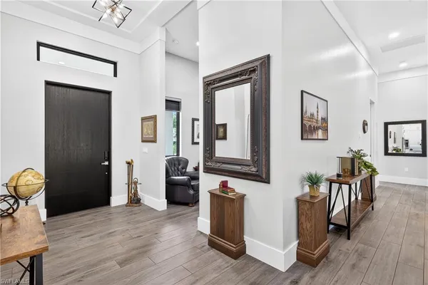a view of a livingroom with furniture and wooden floor