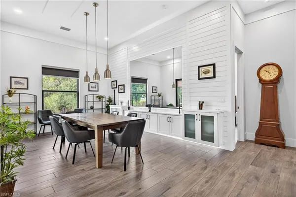 a view of a dining room with furniture window and wooden floor