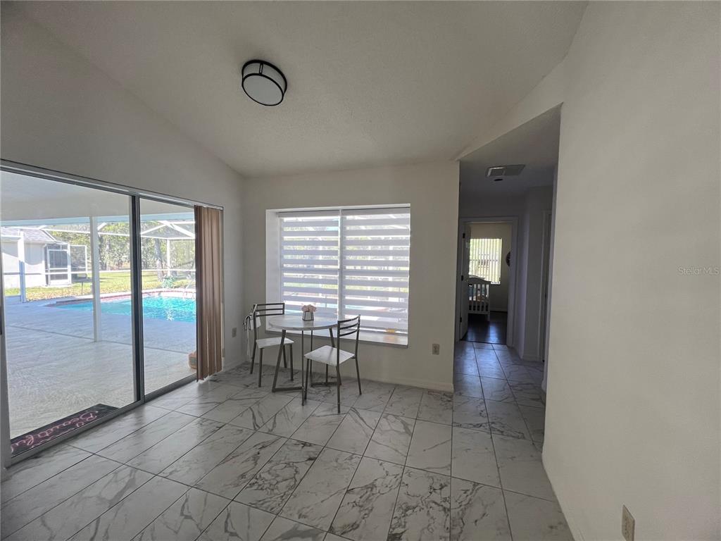 14189 Cornewall Lane Spring Hill, FL 34609 - Photo 28 of 36 a view of a livingroom with furniture and window