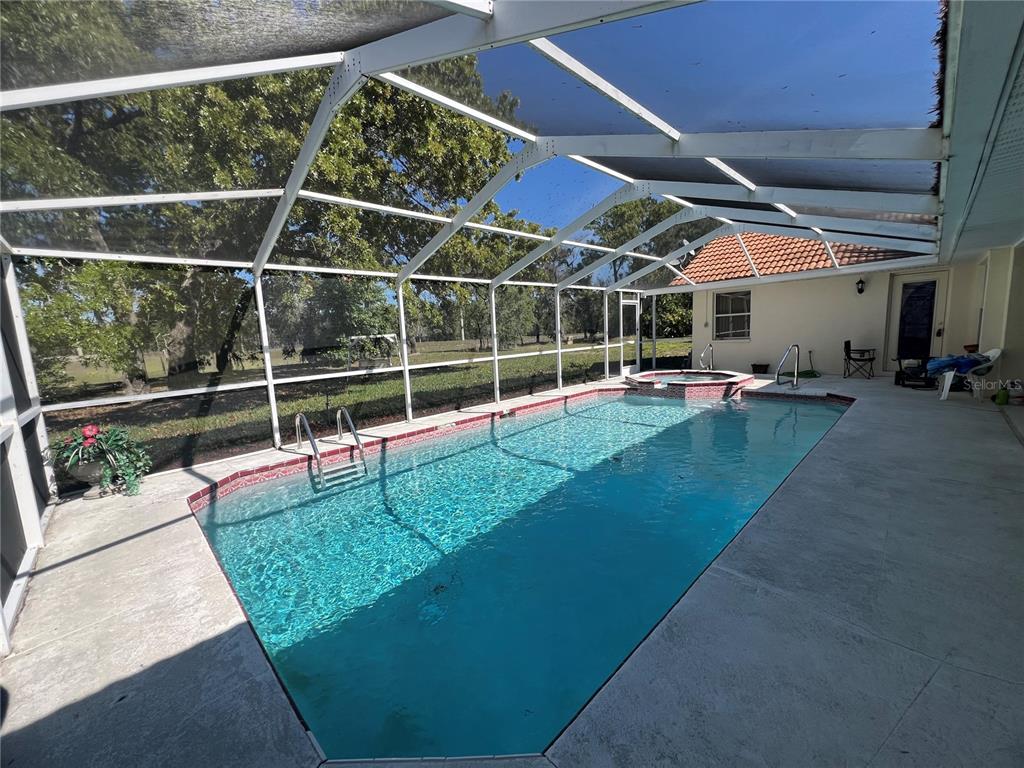 14189 Cornewall Lane Spring Hill, FL 34609 - Photo 33 of 36 a view of an empty room with wooden floor and fence