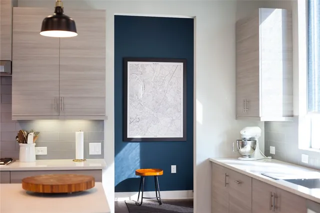 a kitchen with a stove and cabinets