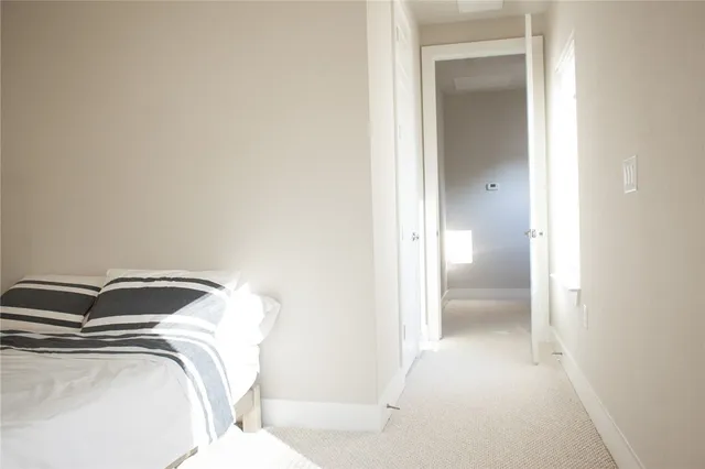 a view of a dining room with furniture and a window