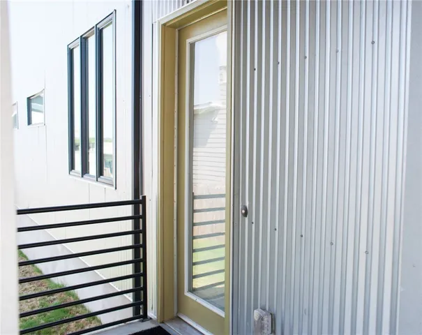 a front view of a house with wooden stairs
