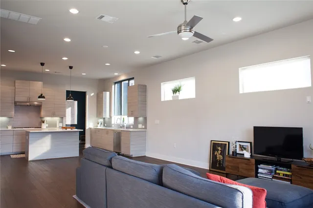 a kitchen with a refrigerator and a sink