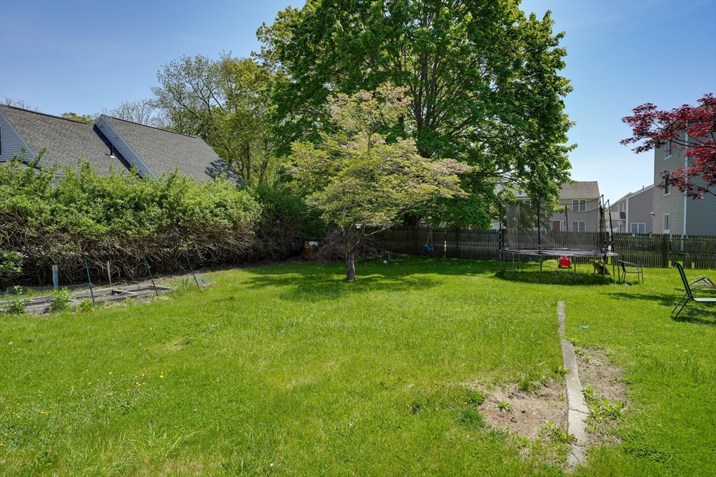 5 Eddy Street, Unit 2 Webster, MA 01570 - Photo 7 of 18 a view of a backyard with a garden