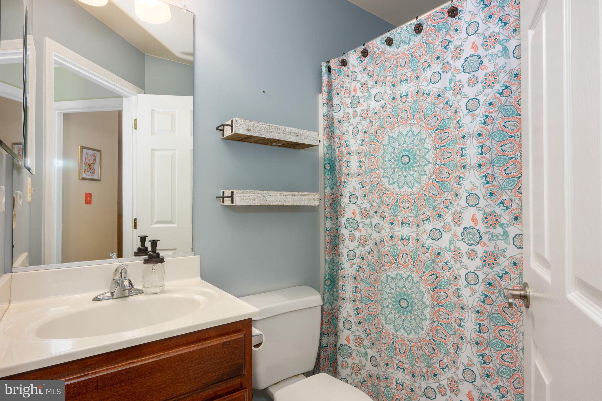2308 Quilting Bee Road Catonsville, MD 21228 - Photo 14 of 37 a bathroom with a sink toilet and shower