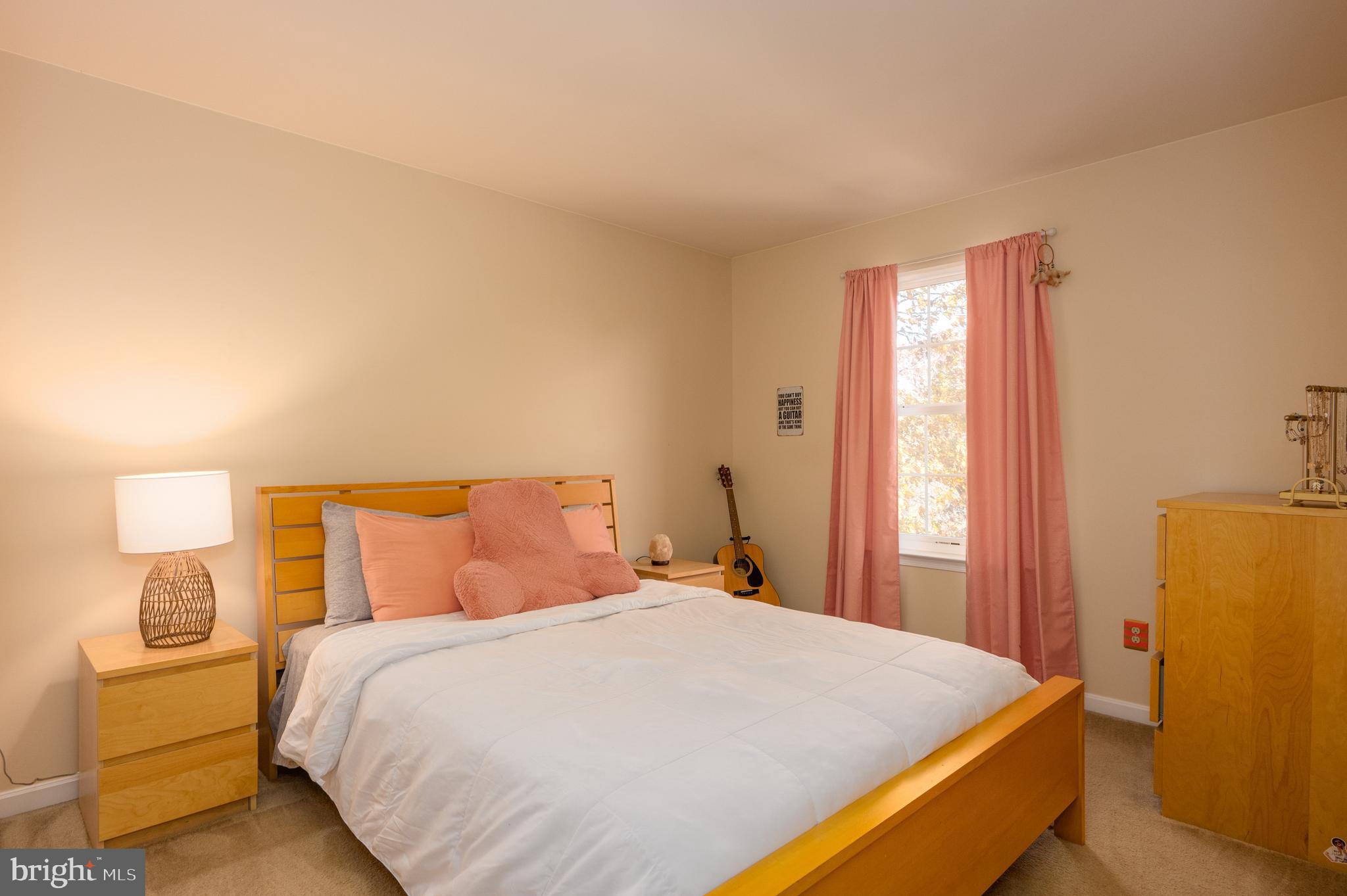 2308 Quilting Bee Road Catonsville, MD 21228 - Photo 15 of 37 a bedroom with a bed and dresser