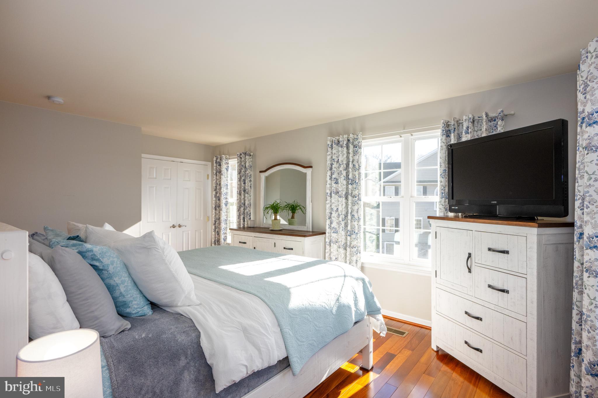 2308 Quilting Bee Road Catonsville, MD 21228 - Photo 19 of 37 a bedroom with a bed and a flat screen tv