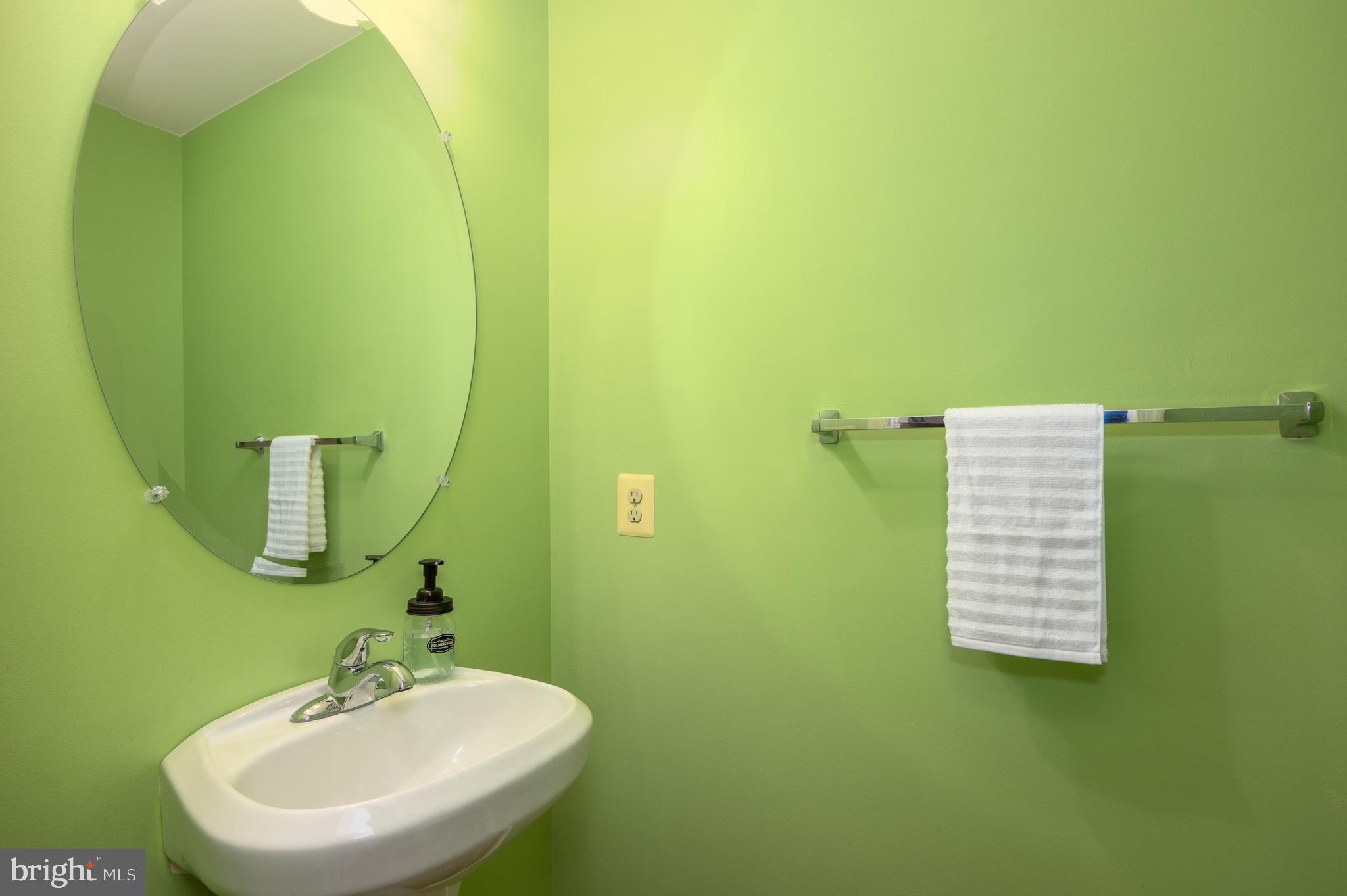 2308 Quilting Bee Road Catonsville, MD 21228 - Photo 25 of 37 a bathroom with a sink and a mirror