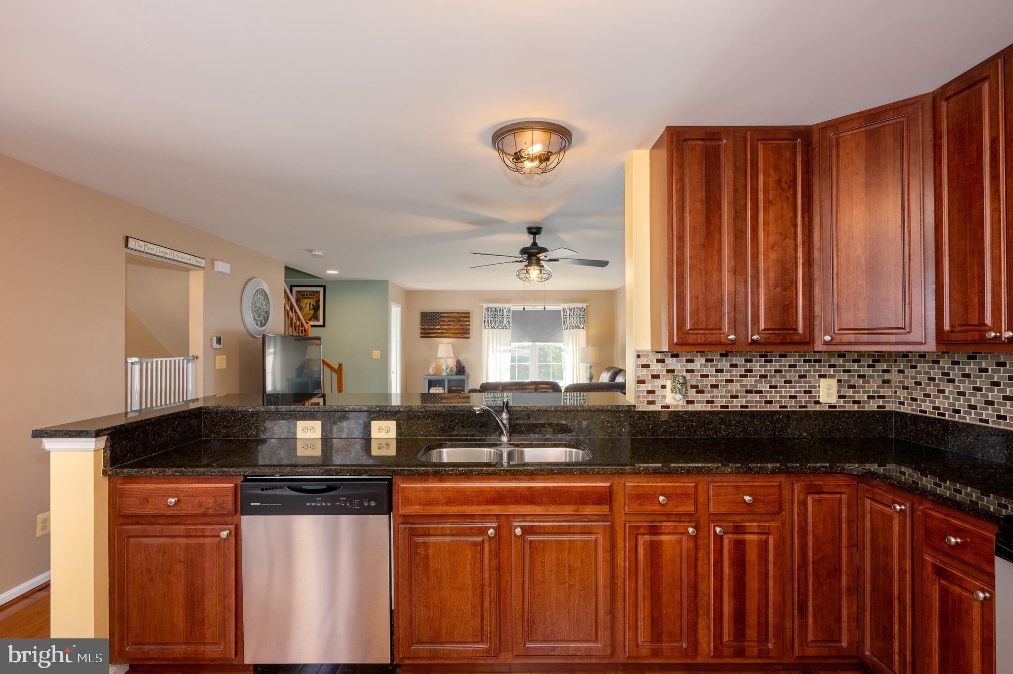 2308 Quilting Bee Road Catonsville, MD 21228 - Photo 4 of 37 a kitchen with granite countertop a sink and cabinets