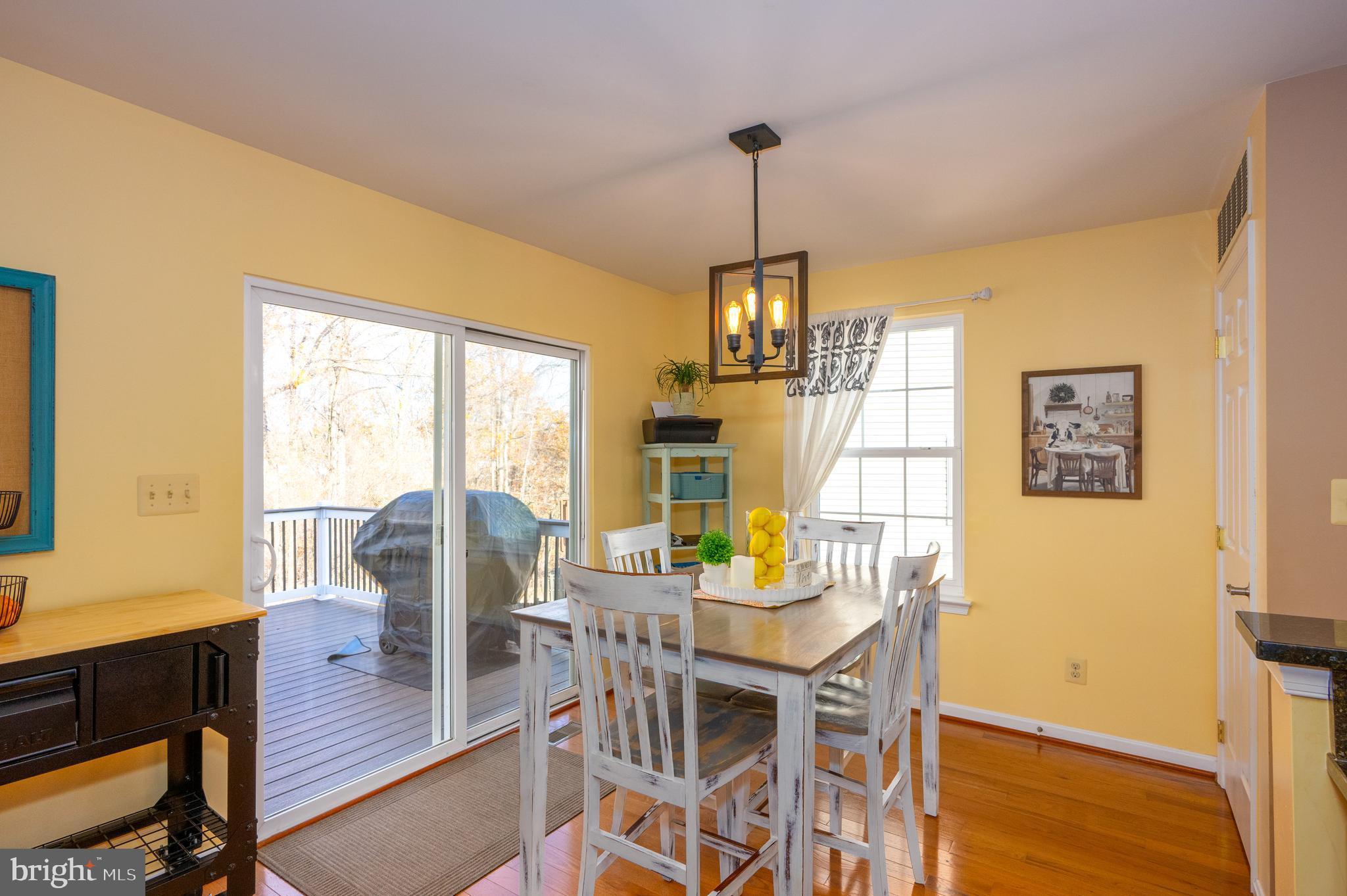 2308 Quilting Bee Road Catonsville, MD 21228 - Photo 8 of 37 a view of a dining room with furniture window and wooden floor