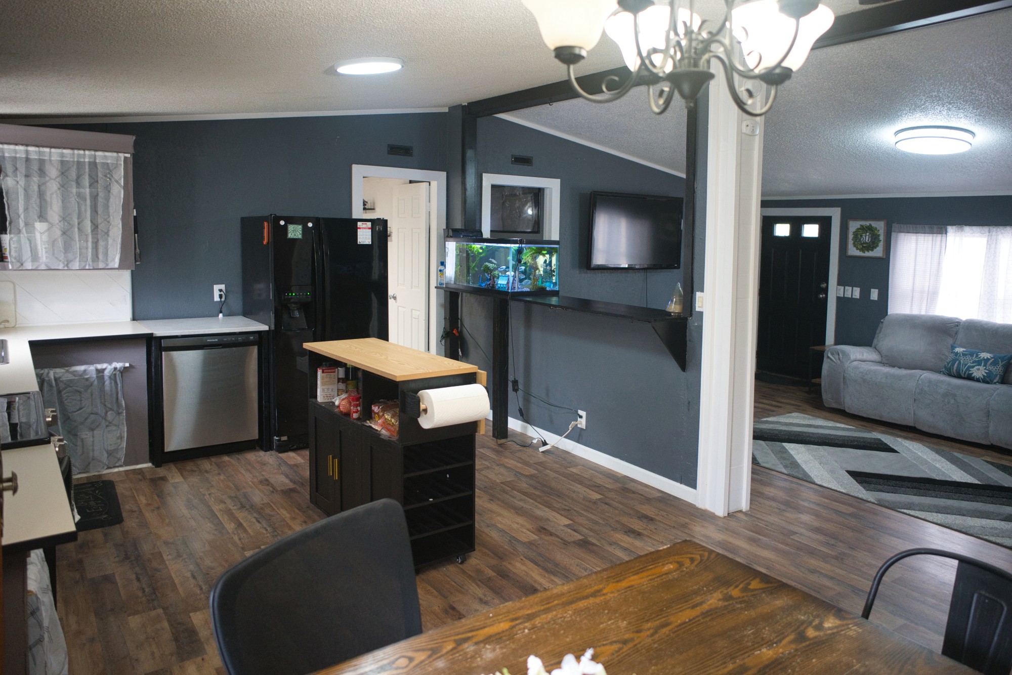 3079 Trace Creek Road White Bluff, TN 37187 - Photo 15 of 35 a living room with furniture a chandelier and a dining room