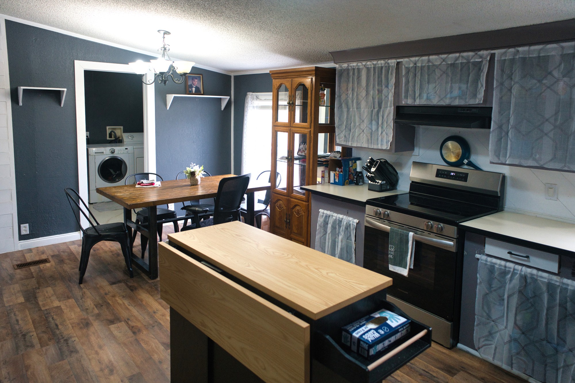 3079 Trace Creek Road White Bluff, TN 37187 - Photo 16 of 35 a kitchen with a stove a refrigerator a dining table and chairs