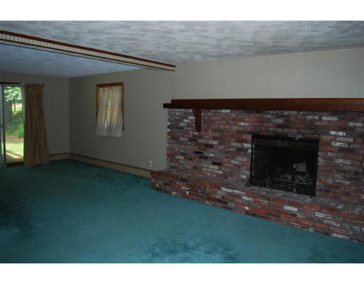 11 Handel Road Billerica, MA 01821 - Photo 12 of 16 a living room with a fireplace