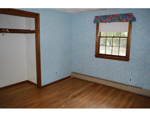 11 Handel Road Billerica, MA 01821 - Photo 8 of 16 a view of an empty room with wooden floor and a window