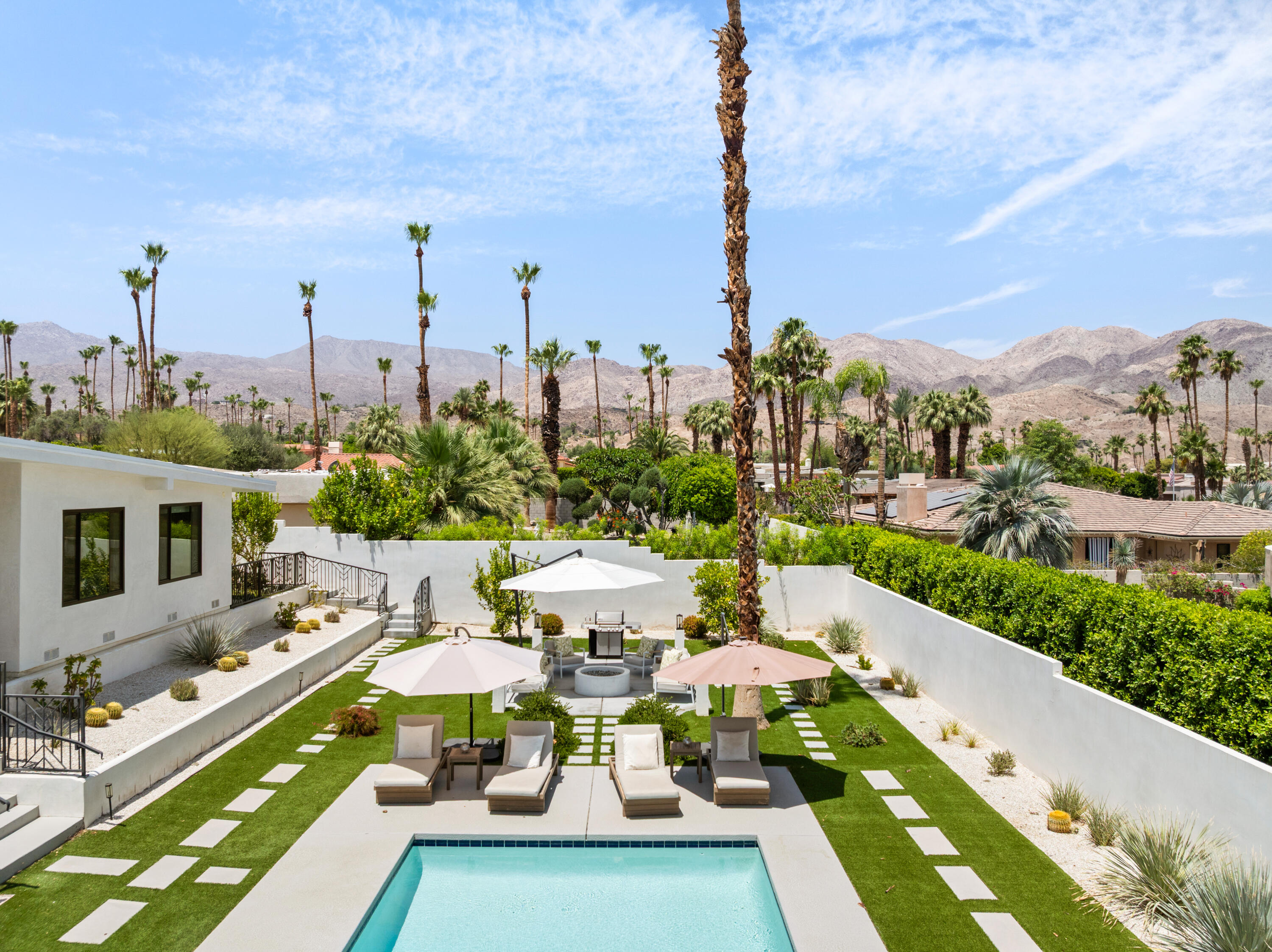 72870 Bel Air Road, Unit 4 Palm Desert, CA 92260 - Photo 19 of 35 a view of a city from a terrace