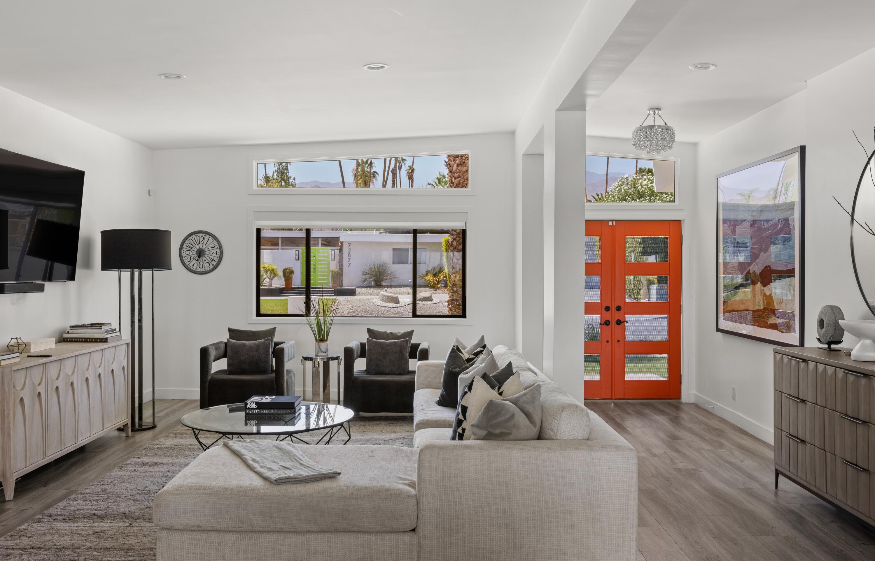 72870 Bel Air Road, Unit 4 Palm Desert, CA 92260 - Photo 3 of 35 a living room with furniture and a flat screen tv