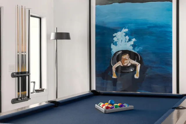 a room with water heater and wooden floor