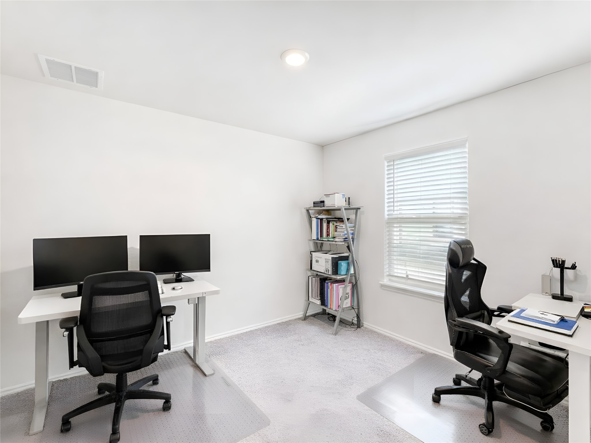 159 Kennicott Drive Kyle, TX 78640 - Photo 20 of 27 a view of a workspace with furniture and a window