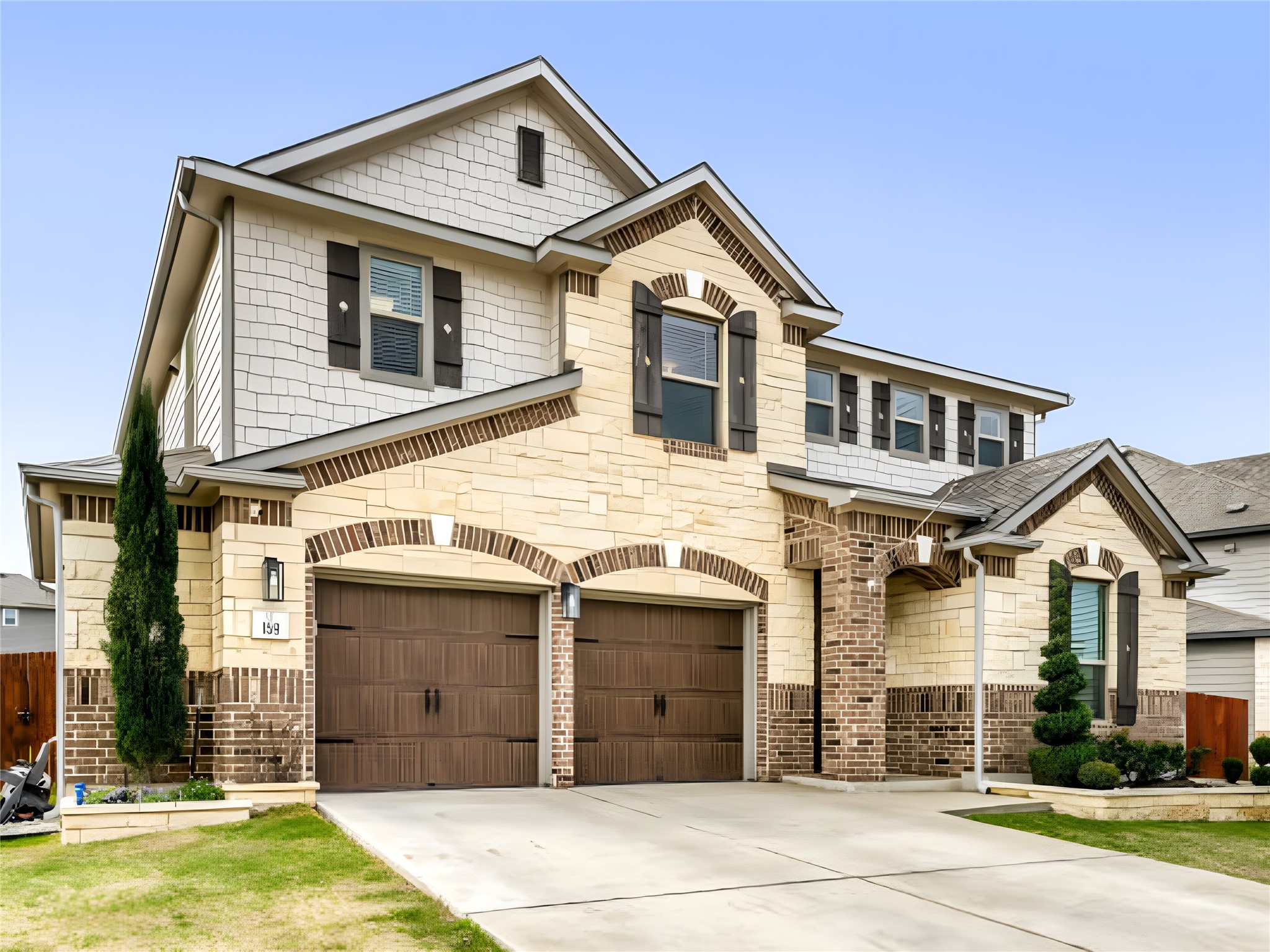159 Kennicott Drive Kyle, TX 78640 - Photo 2 of 27 a front view of a house with a yard