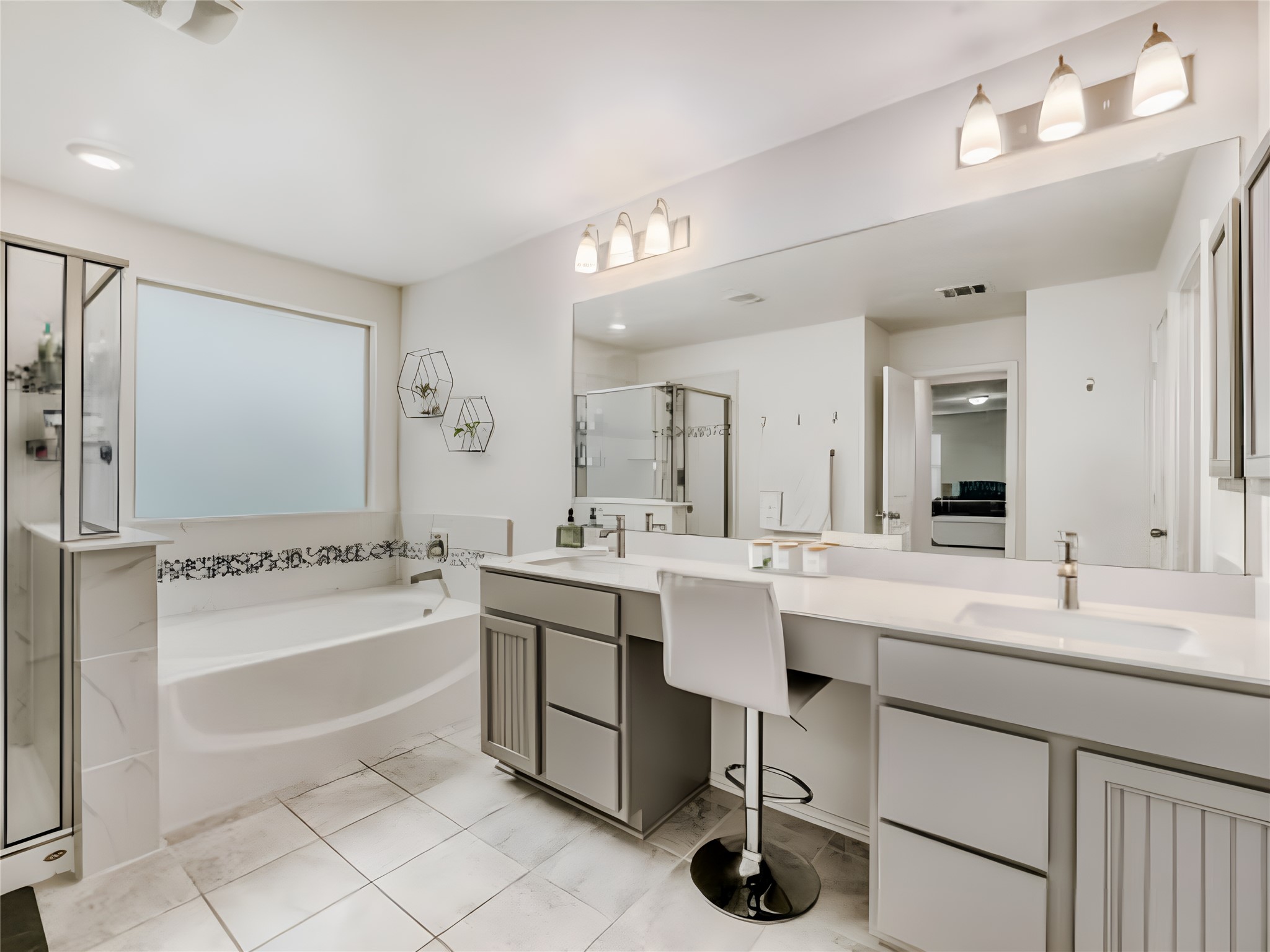 159 Kennicott Drive Kyle, TX 78640 - Photo 22 of 27 a bathroom with a double vanity sink mirror and bathtub