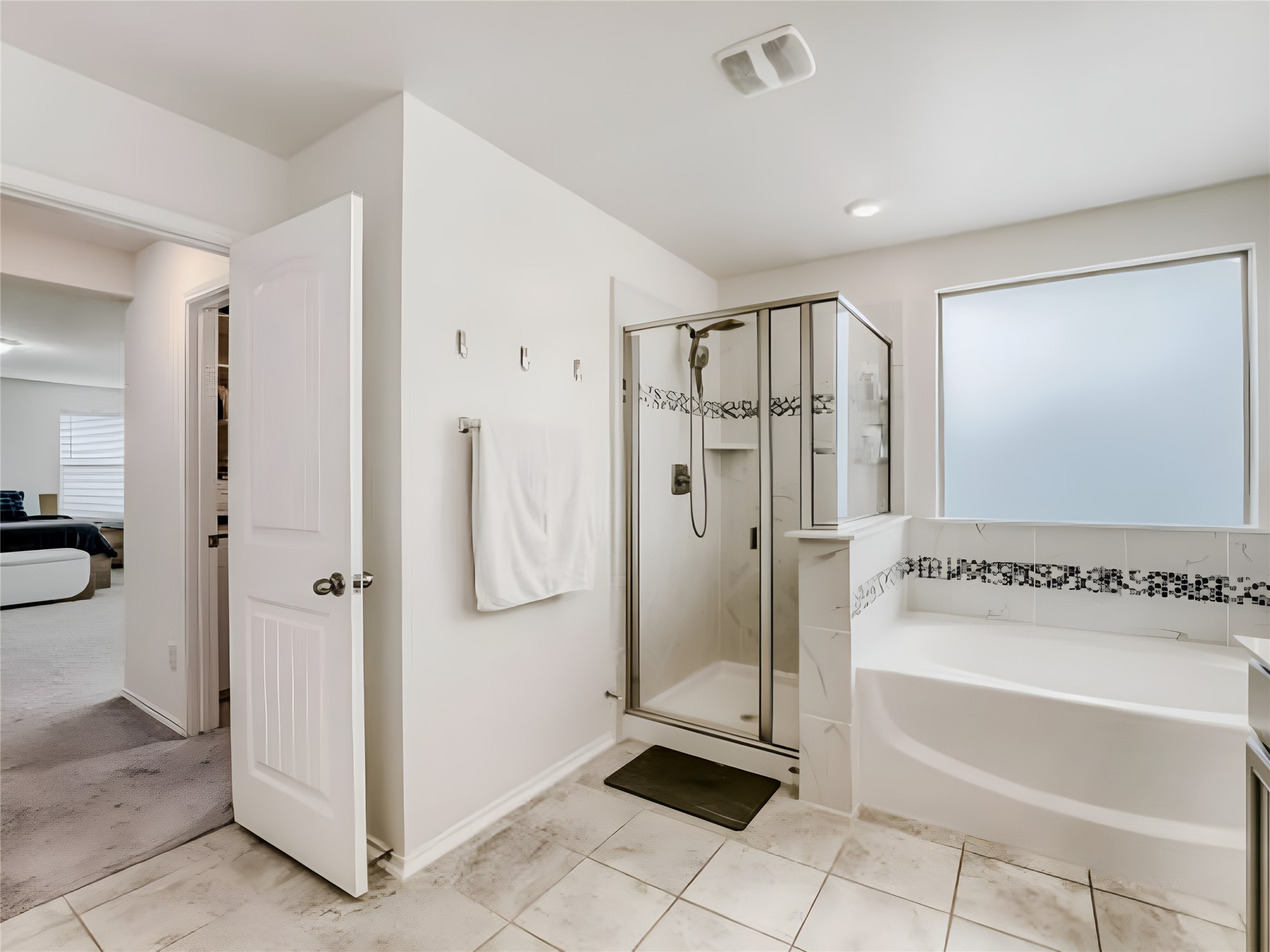 159 Kennicott Drive Kyle, TX 78640 - Photo 23 of 27 a bathroom with a bathtub and a shower