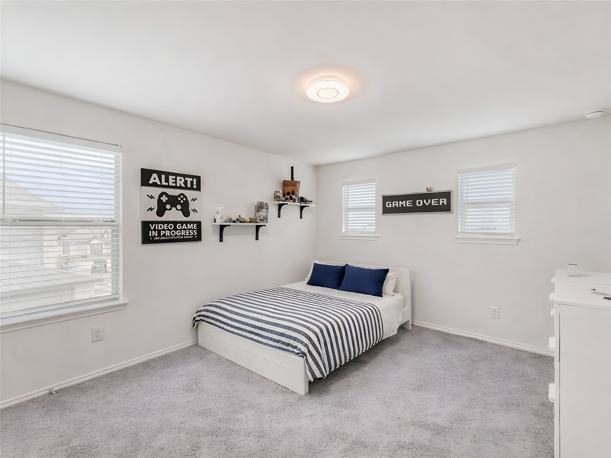 159 Kennicott Drive Kyle, TX 78640 - Photo 25 of 27 a bedroom with a bed and a window