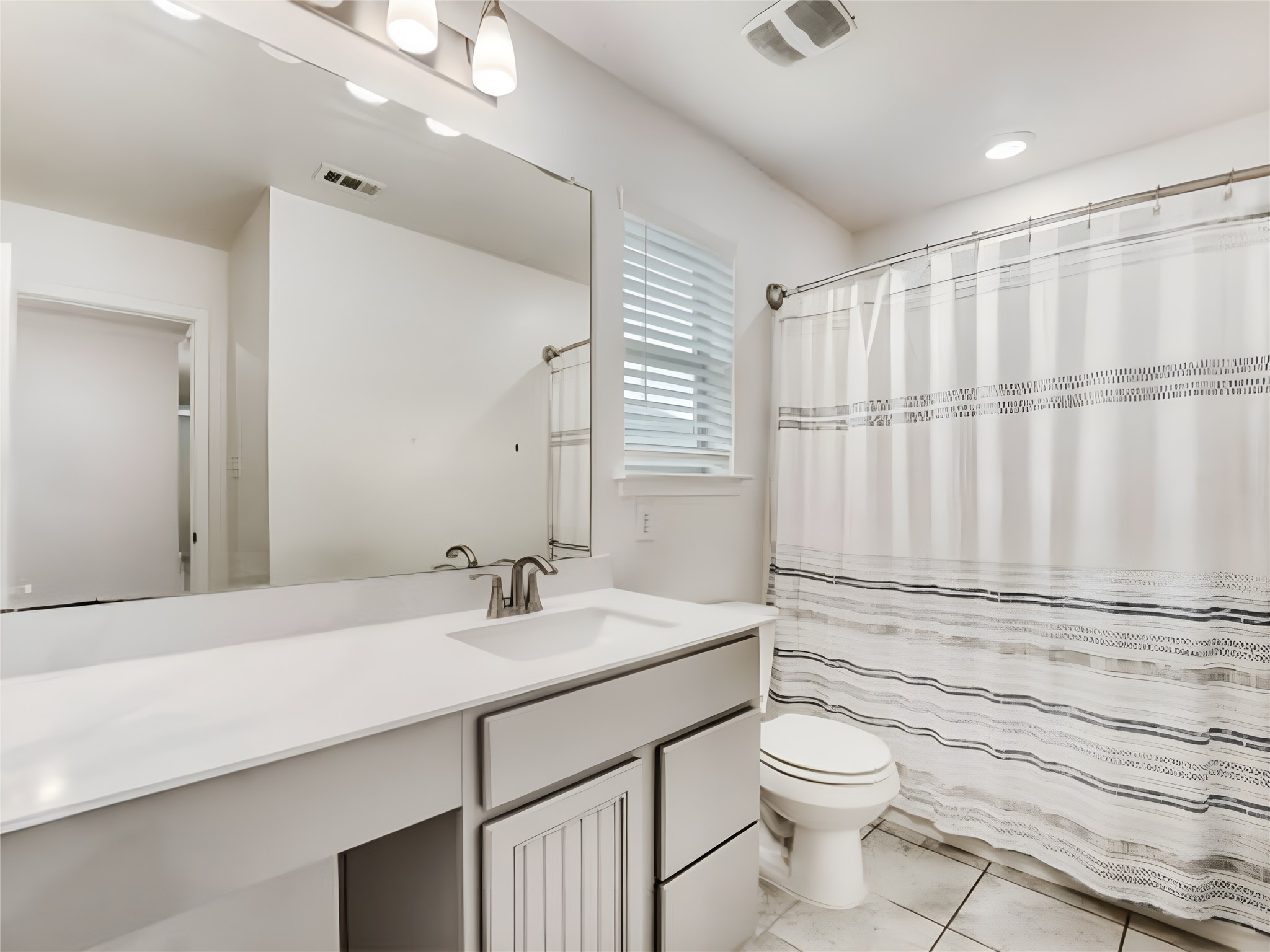 159 Kennicott Drive Kyle, TX 78640 - Photo 27 of 27 a bathroom with a granite countertop sink a toilet and shower