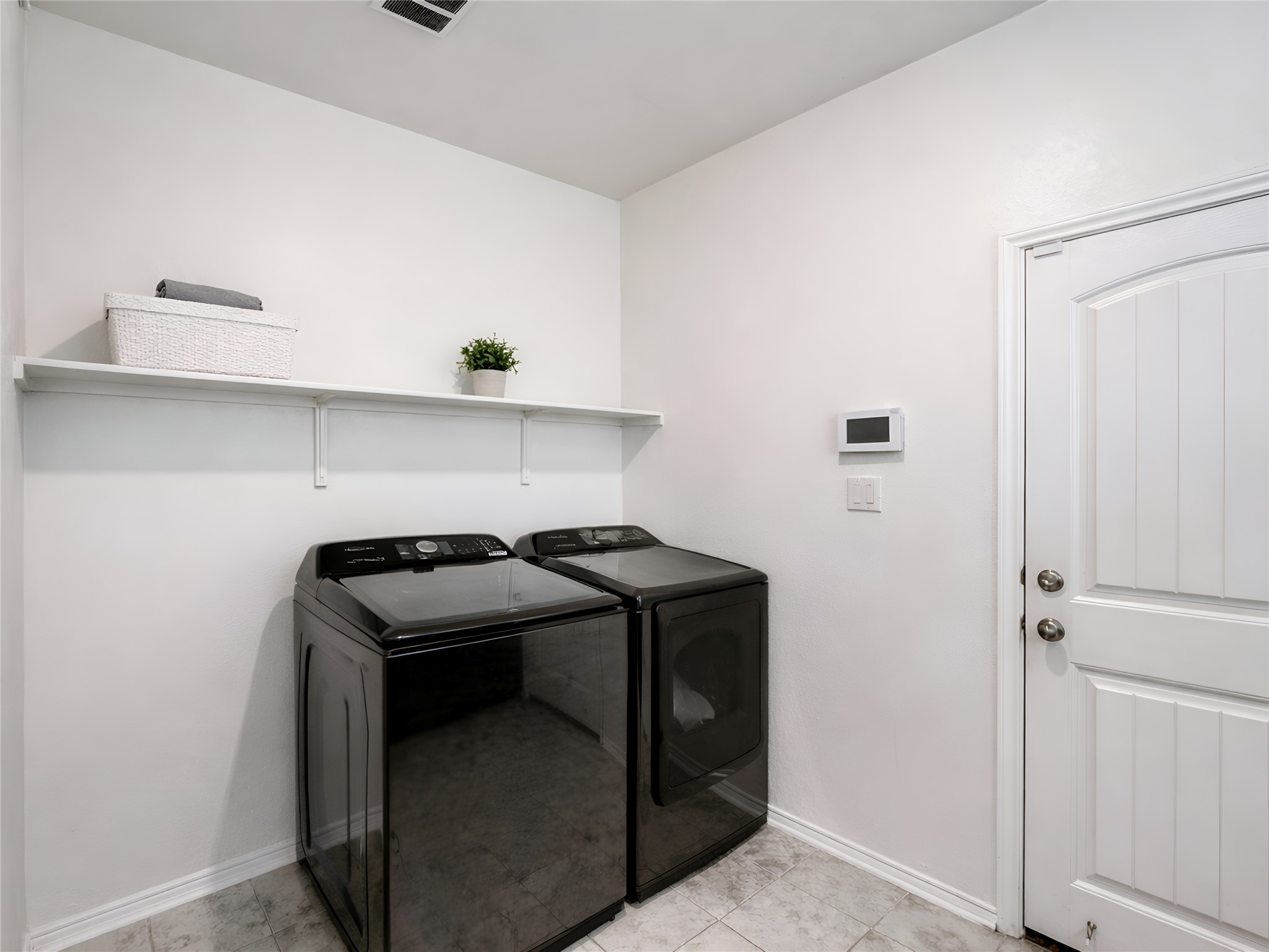 159 Kennicott Drive Kyle, TX 78640 - Photo 7 of 27 a view of storage and utility room with washer and dryer
