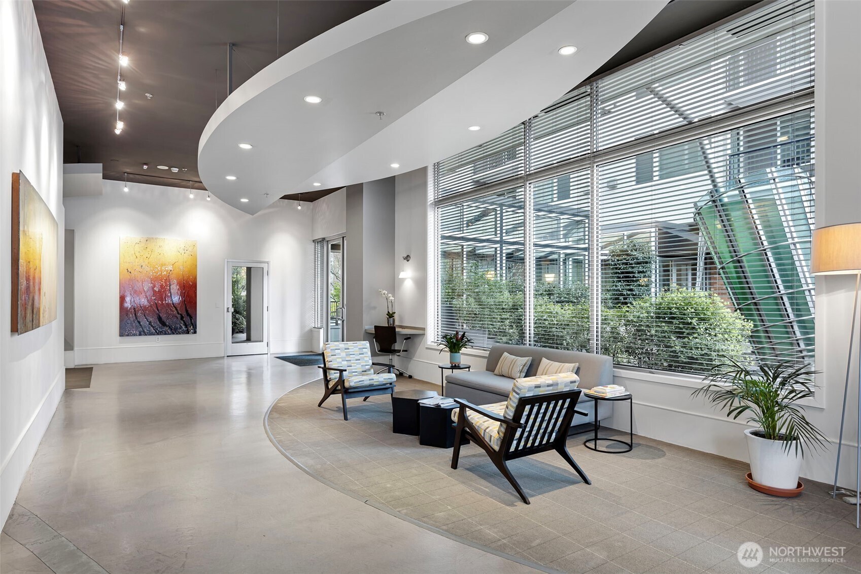 2801 1st Avenue, Unit 612 Seattle, WA 98121 - Photo 21 of 25 a living room with furniture and potted plants