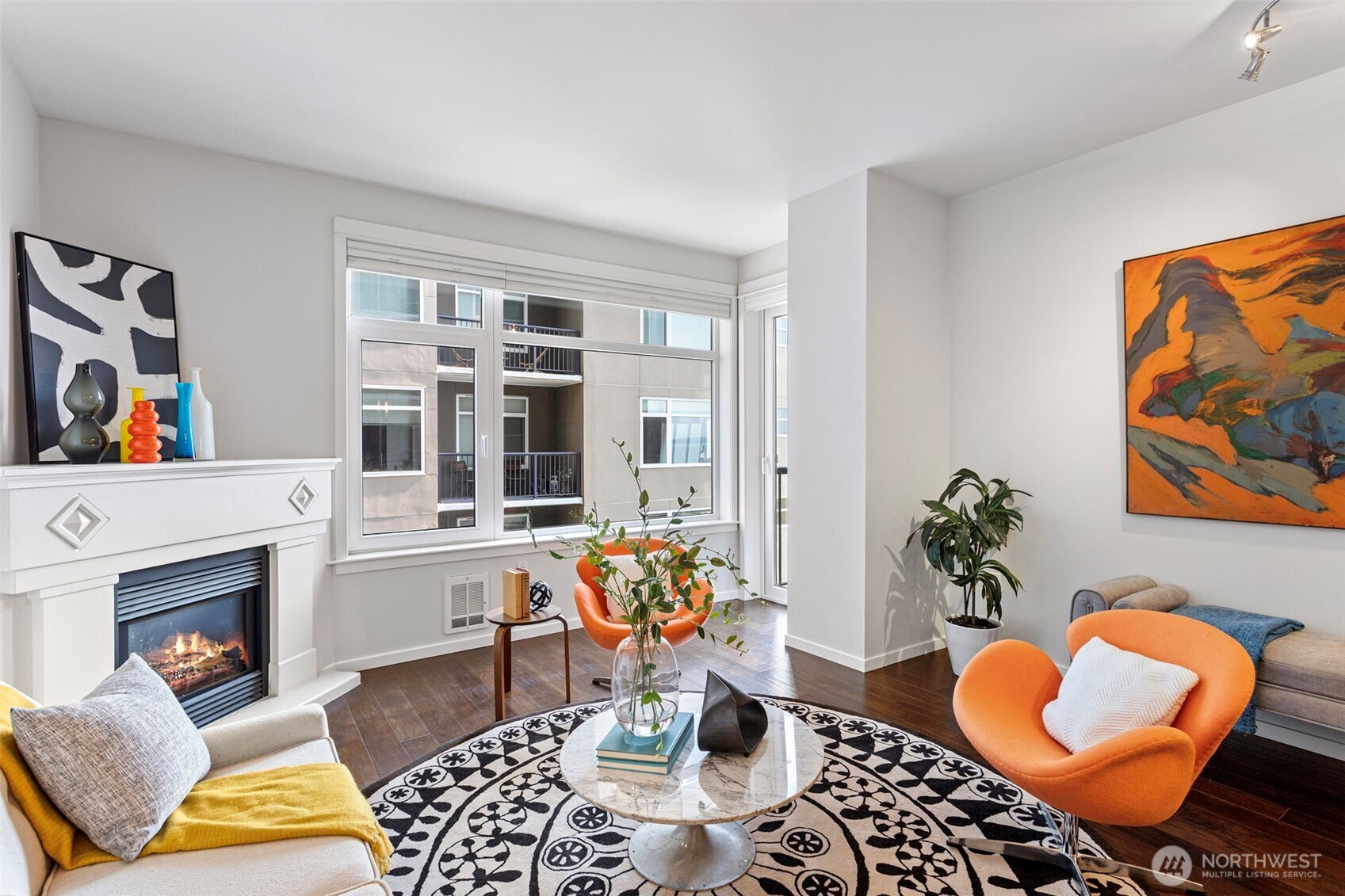 2801 1st Avenue, Unit 612 Seattle, WA 98121 - Photo 5 of 25 a living room with furniture and a potted plant