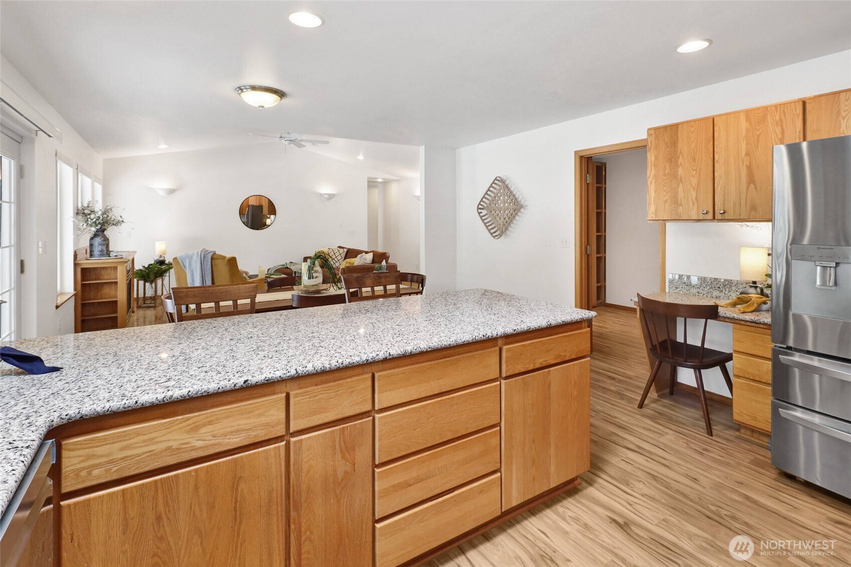 659 Cain Lake Road Sedro-Woolley, WA 98284 - Photo 20 of 40 a kitchen with stainless steel appliances granite countertop a sink and a wooden cabinets