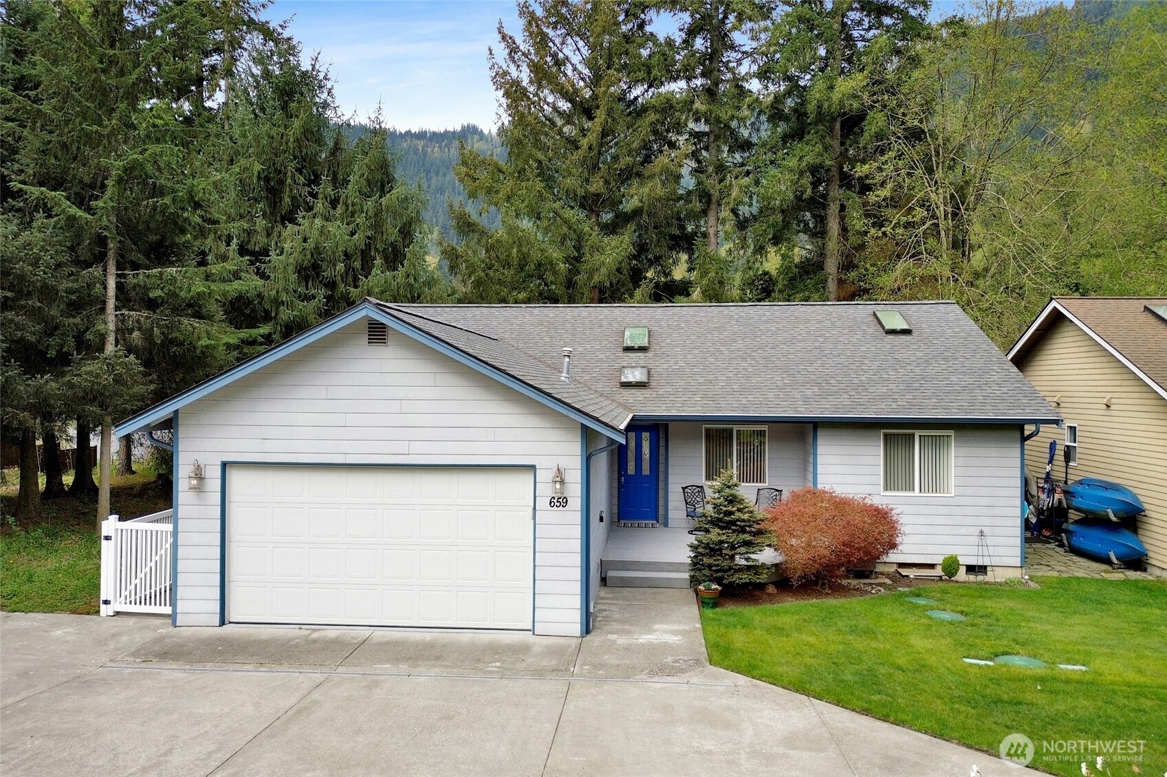 659 Cain Lake Road Sedro-Woolley, WA 98284 - Photo 26 of 40 a front view of a house with a garden