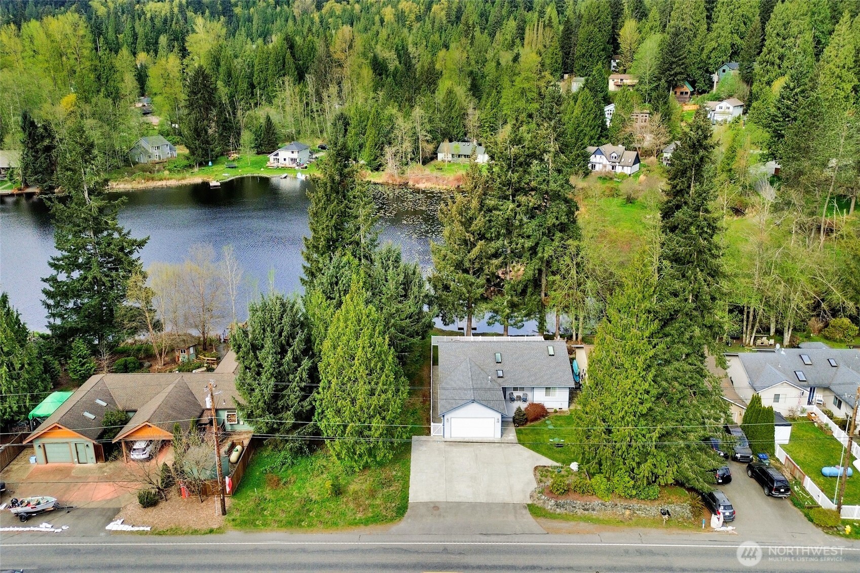 659 Cain Lake Road Sedro-Woolley, WA 98284 - Photo 29 of 40 an aerial view of a house with outdoor space and lake view