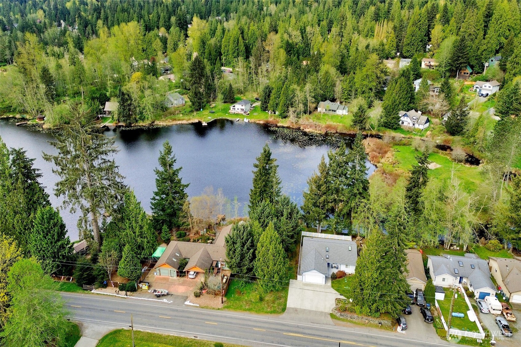 659 Cain Lake Road Sedro-Woolley, WA 98284 - Photo 32 of 40 an aerial view of residential houses with outdoor space and lake view