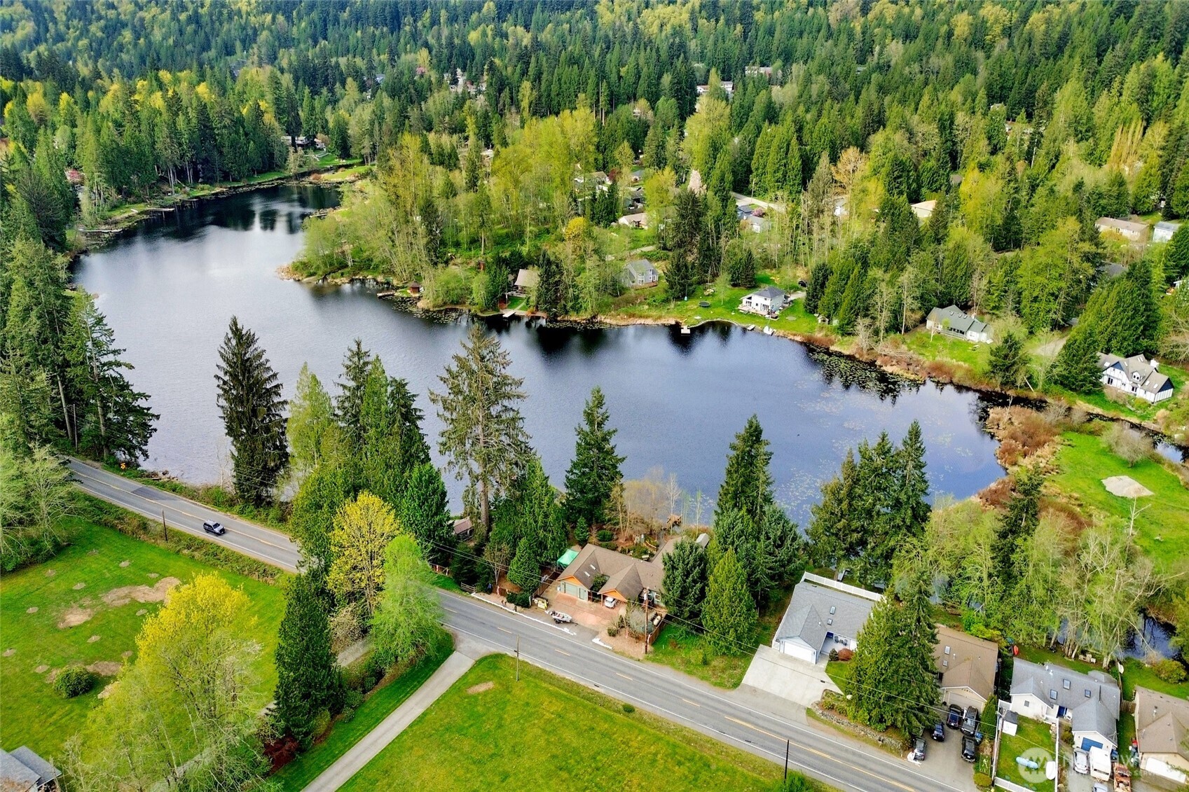 659 Cain Lake Road Sedro-Woolley, WA 98284 - Photo 33 of 40 an aerial view of residential houses with outdoor space and trees all around