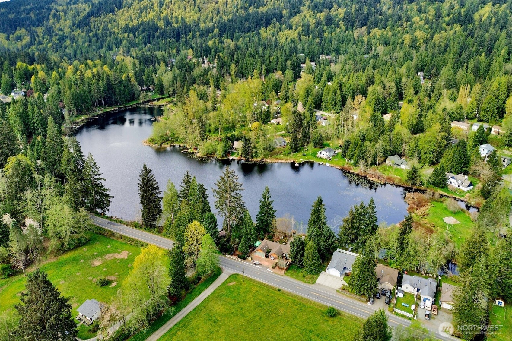 659 Cain Lake Road Sedro-Woolley, WA 98284 - Photo 34 of 40 an aerial view of lake residential house with swimming pool and outdoor space