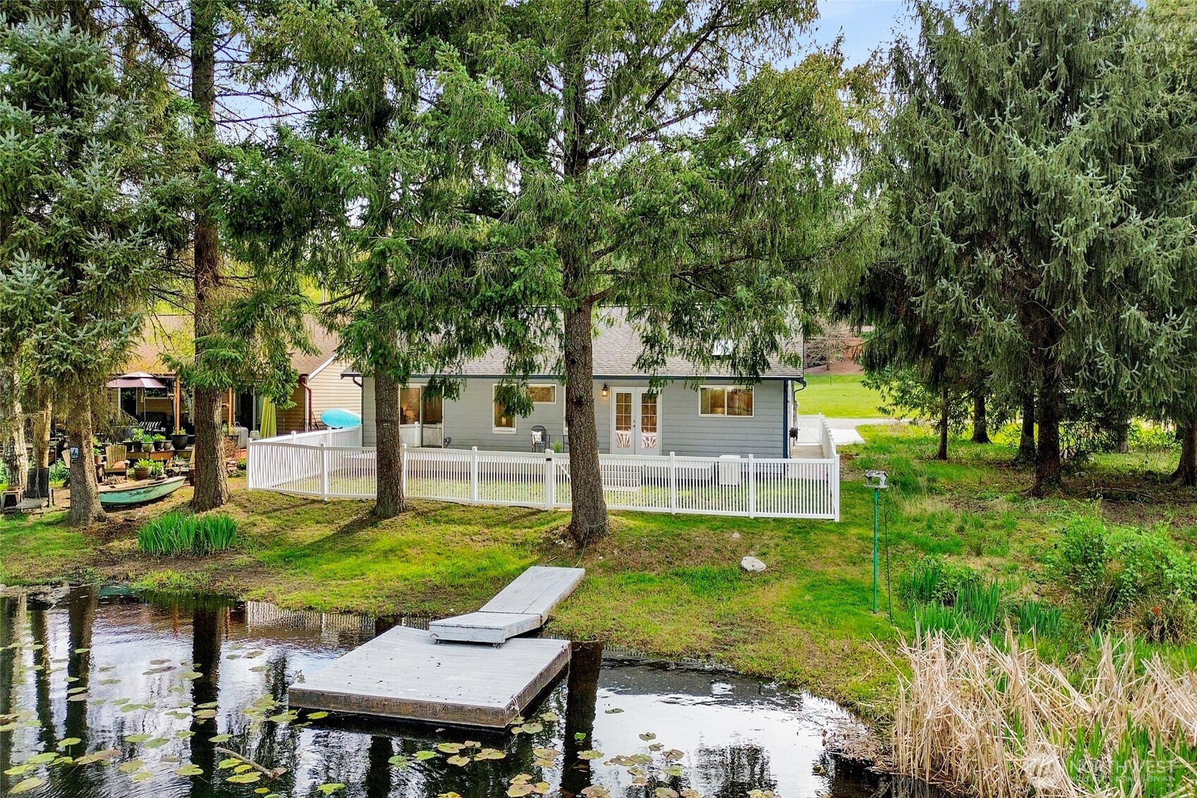 659 Cain Lake Road Sedro-Woolley, WA 98284 - Photo 37 of 40 a view of a house with a yard patio and a slide
