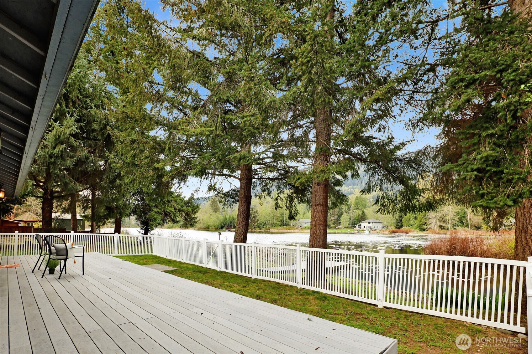 659 Cain Lake Road Sedro-Woolley, WA 98284 - Photo 4 of 40 a view of a swimming pool with an outdoor seating
