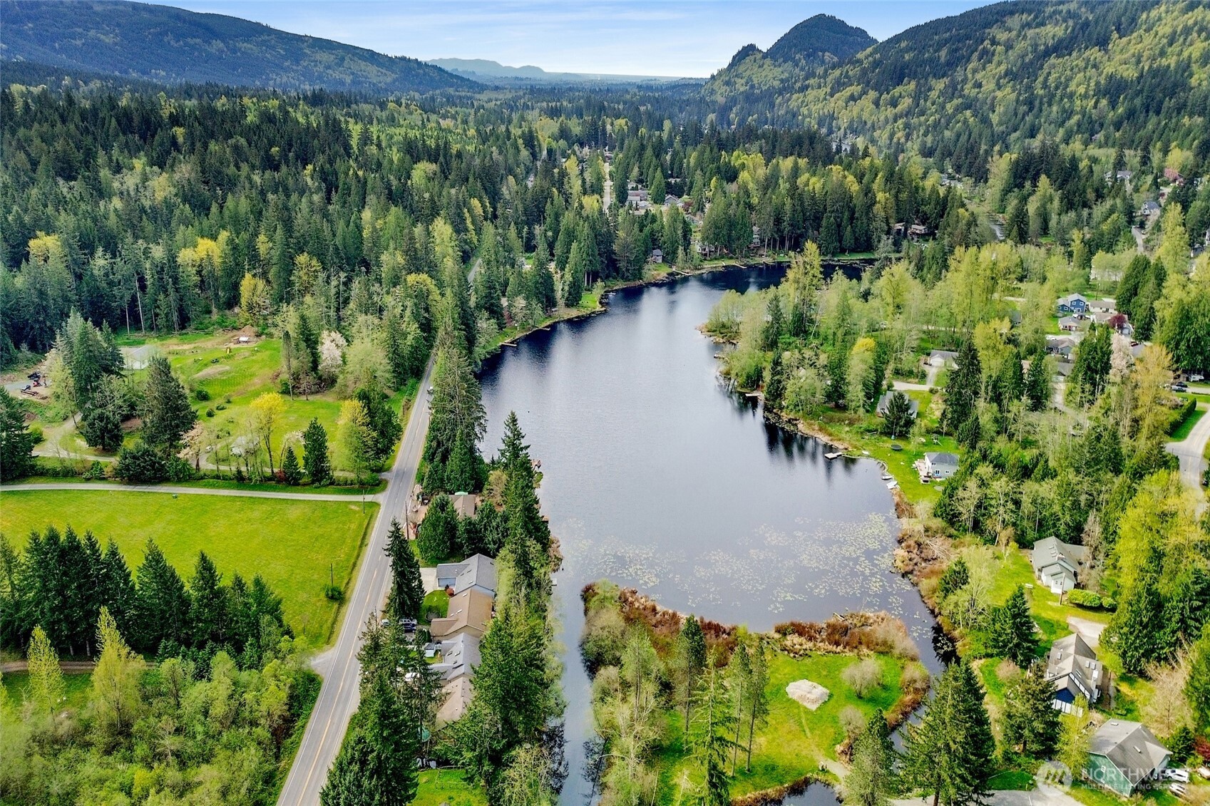 659 Cain Lake Road Sedro-Woolley, WA 98284 - Photo 5 of 40 a view of a garden with a lake