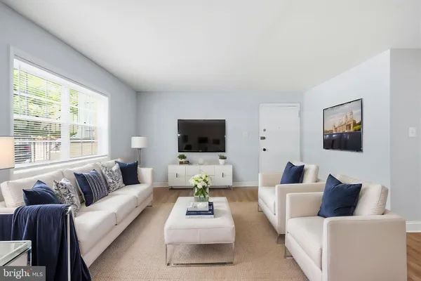 a living room with furniture or couch and a flat screen tv