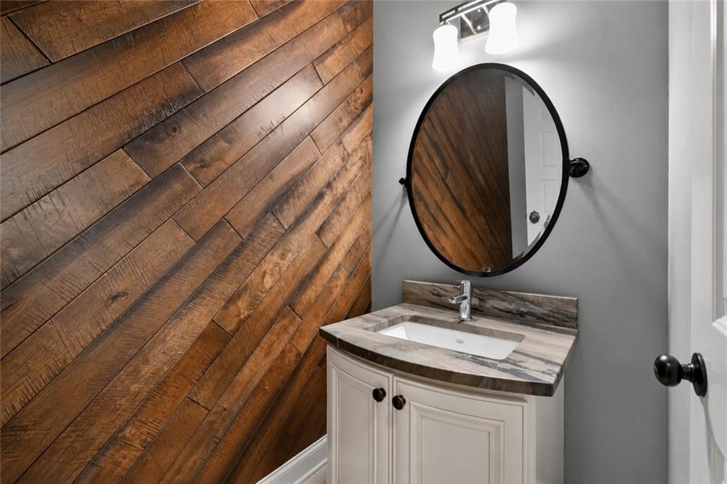 632 Geiger Road Jefferson, GA 30549 - Photo 23 of 55 a bathroom with a sink and a mirror