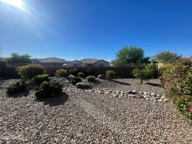a kitchen with a sink and a chandelier