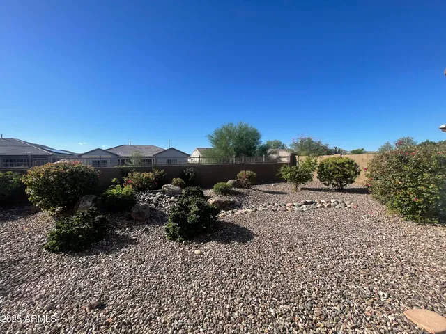 a living room with pool table and a potted plant
