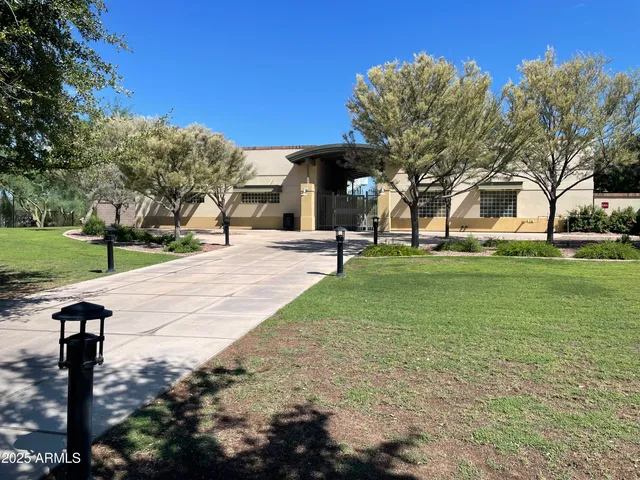 a backyard view with a seating space