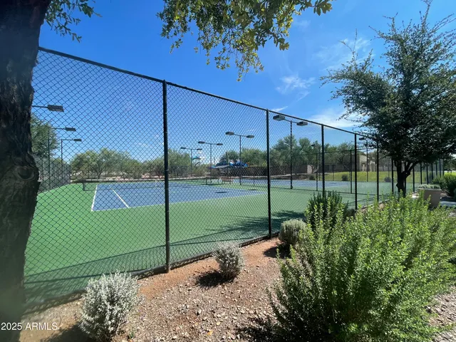 a view of path along with retail shop and buildings